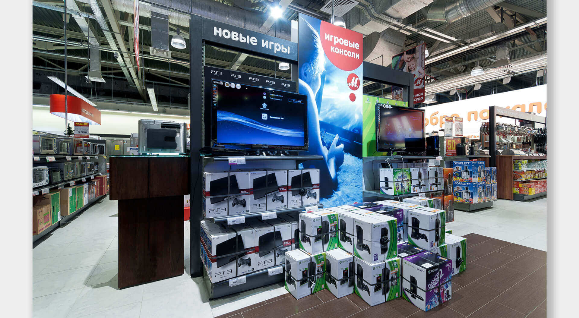 M.Video Russia retail interior store design, branding, household technology electrical homewares signage system M.Video Technology Stores rebrand and interior design POSM brand communications Games station