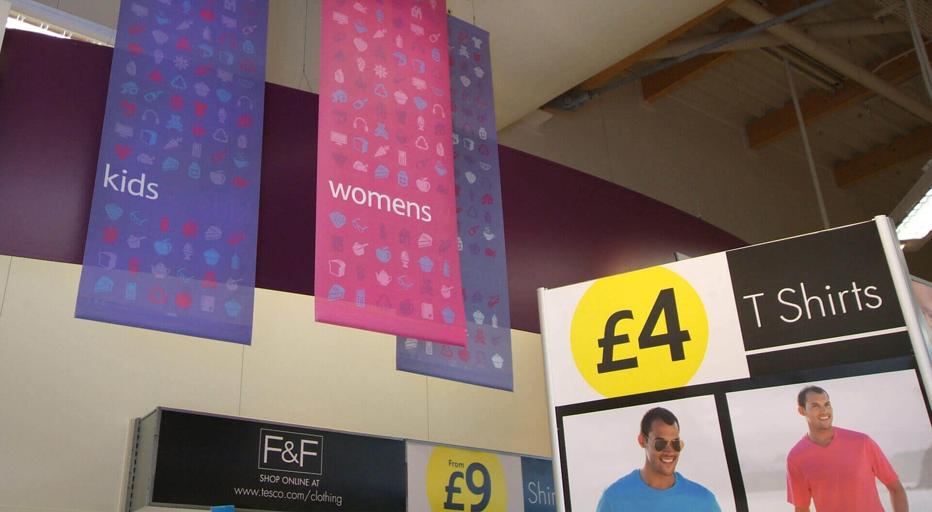 Florence and Fred Tesco fashion Welshpool retail store interior design, rebrand merchandising, lighting system and communications Florence and Fred Tesco fashion Welshpool retail store interior design, rebrand merchandising, colourful hanging banners and price POSM