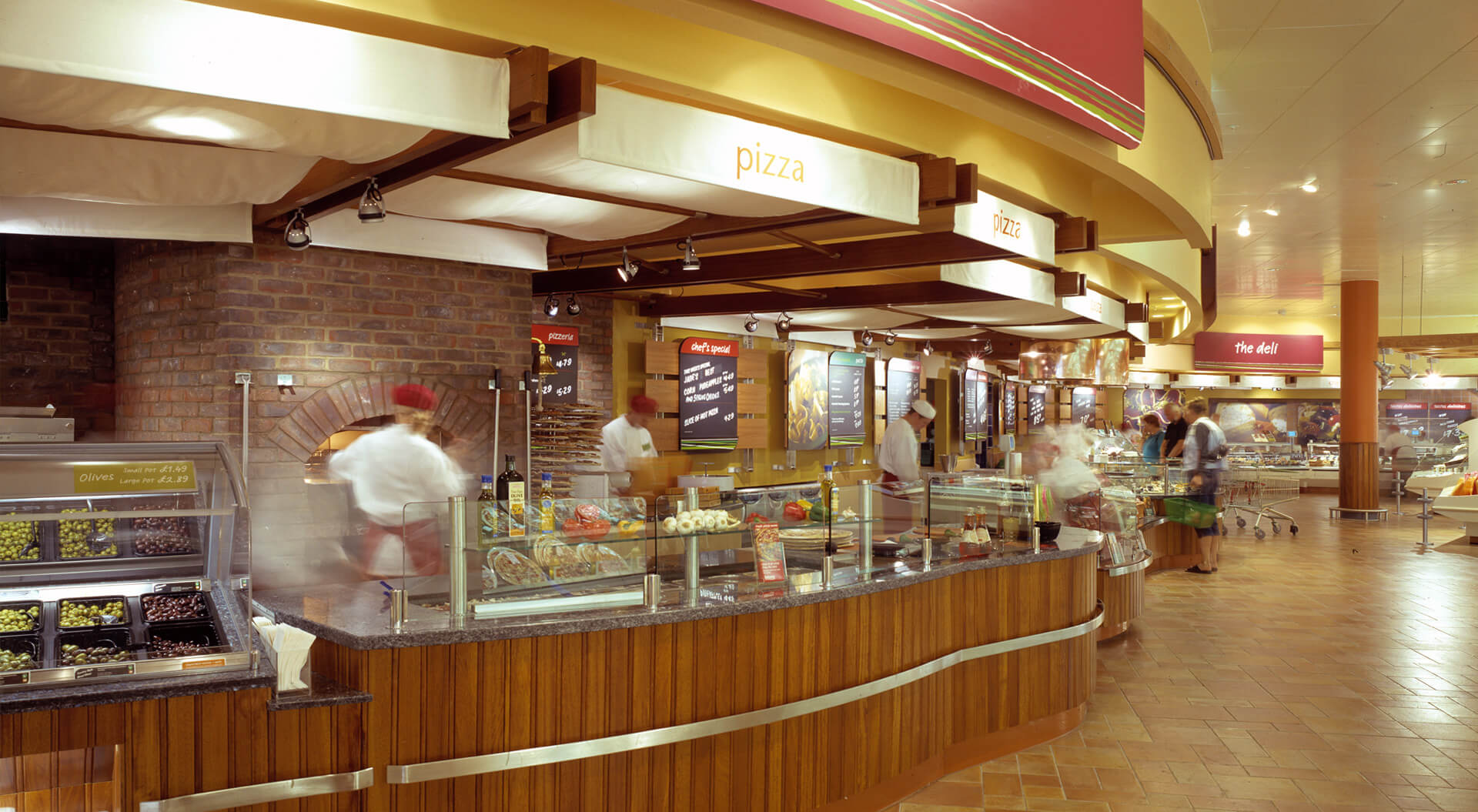 Safeway supermarket interior store design, merchandising and branding for hot food pizza and grill bar counters Safeway supermarket interior store design, merchandising and branding for hot food pizza and grill bar counters