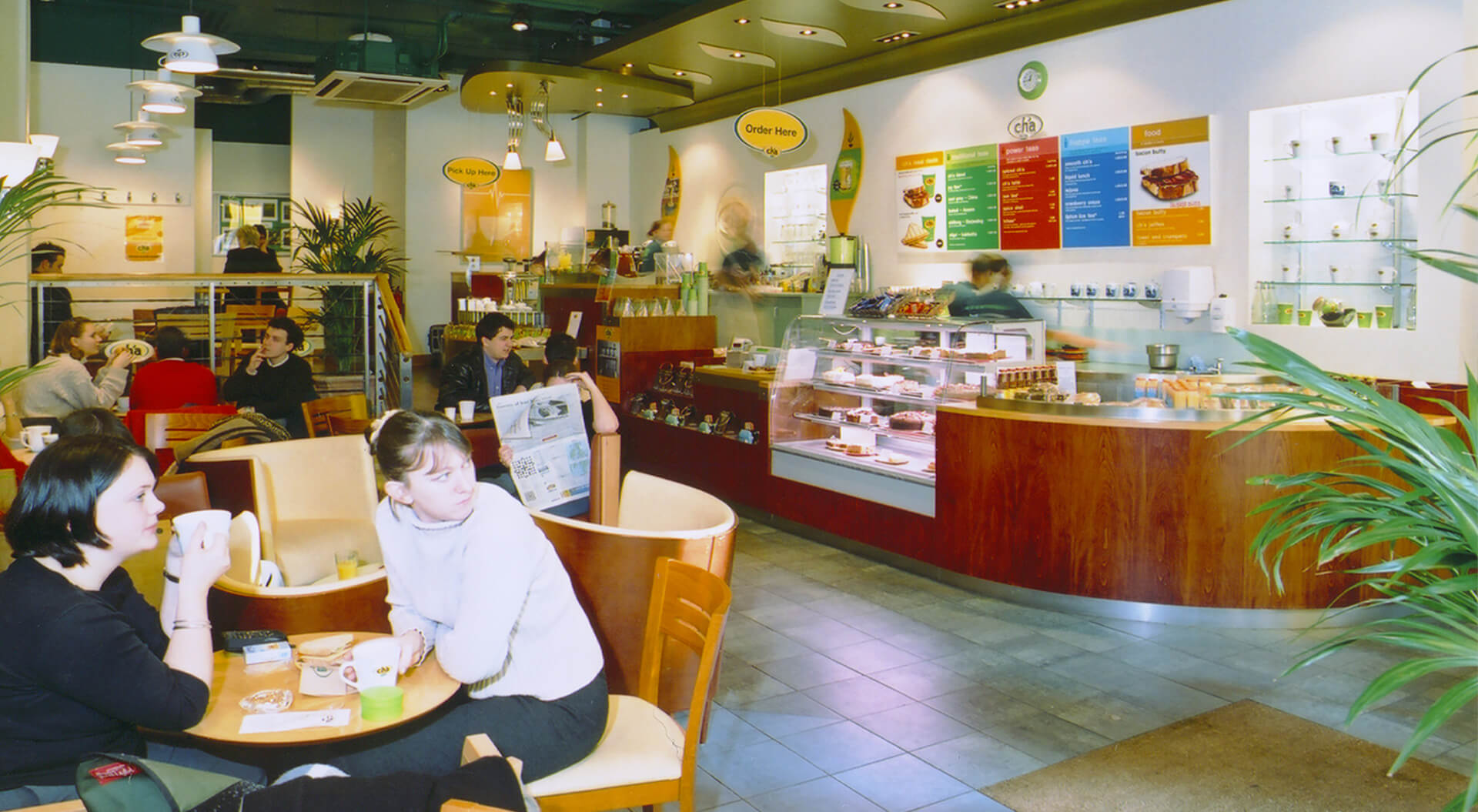 Cha Teahouse café seating area and serve over counter interior design and branding Cha Teahouse café seating area and serve over counter interior design and branding