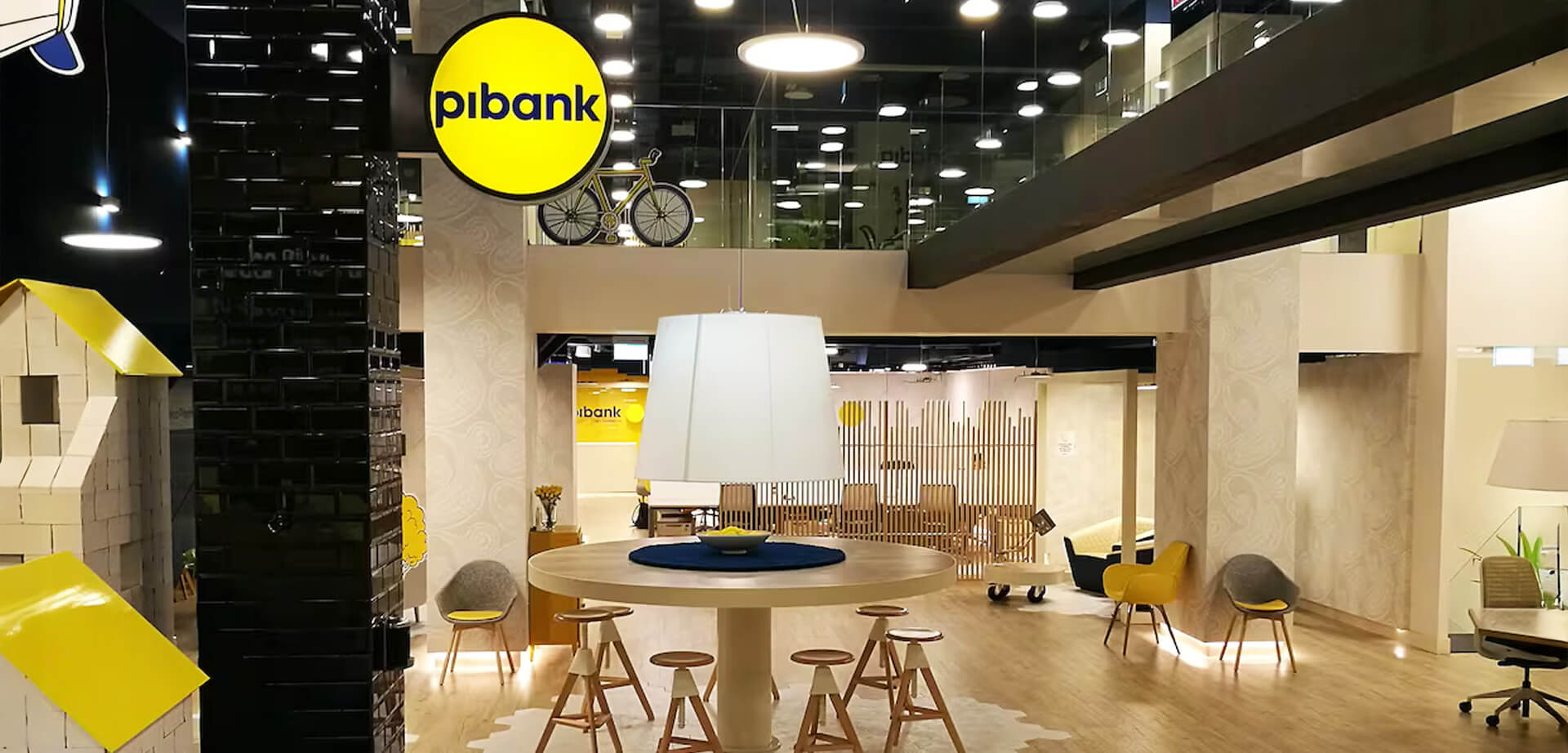 "Phygital micro-branch design. Pibank is a direct and online bank brand that operates in Spain, Colombia, and the United States, offering simple, transparent financial products. It functions primarily through online services and a mobile app
