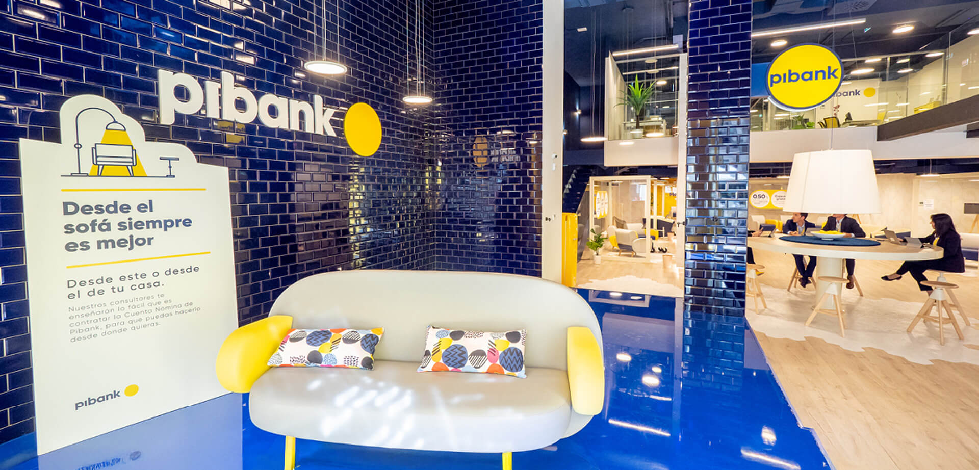 "Phygital micro-branch design. The image displays the interior of a Pibank branch office, a financial institution that is a brand of Pichincha Bank