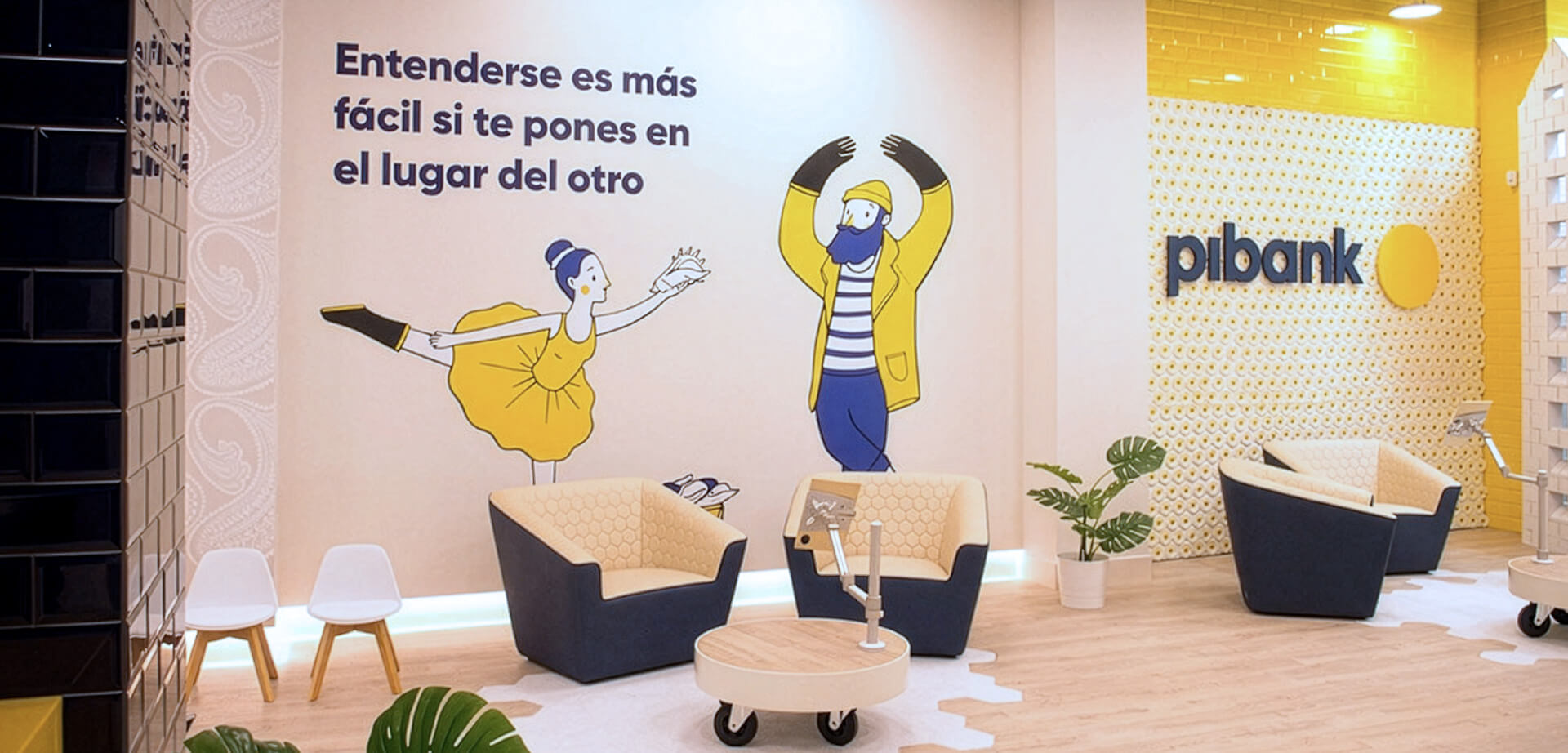 "Phygital micro-branch design. Pibank office, a digital bank that is part of the Pichincha banking group. The text on the wall conveys a message about empathy and understanding. 
