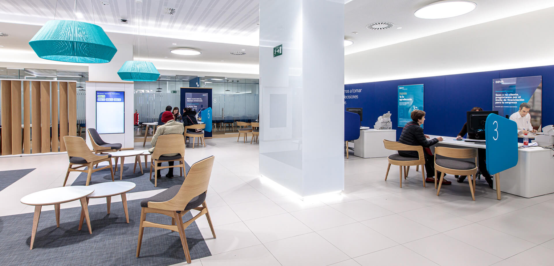 A BBVA bank branch office, designed with a modern, open-plan concept. 