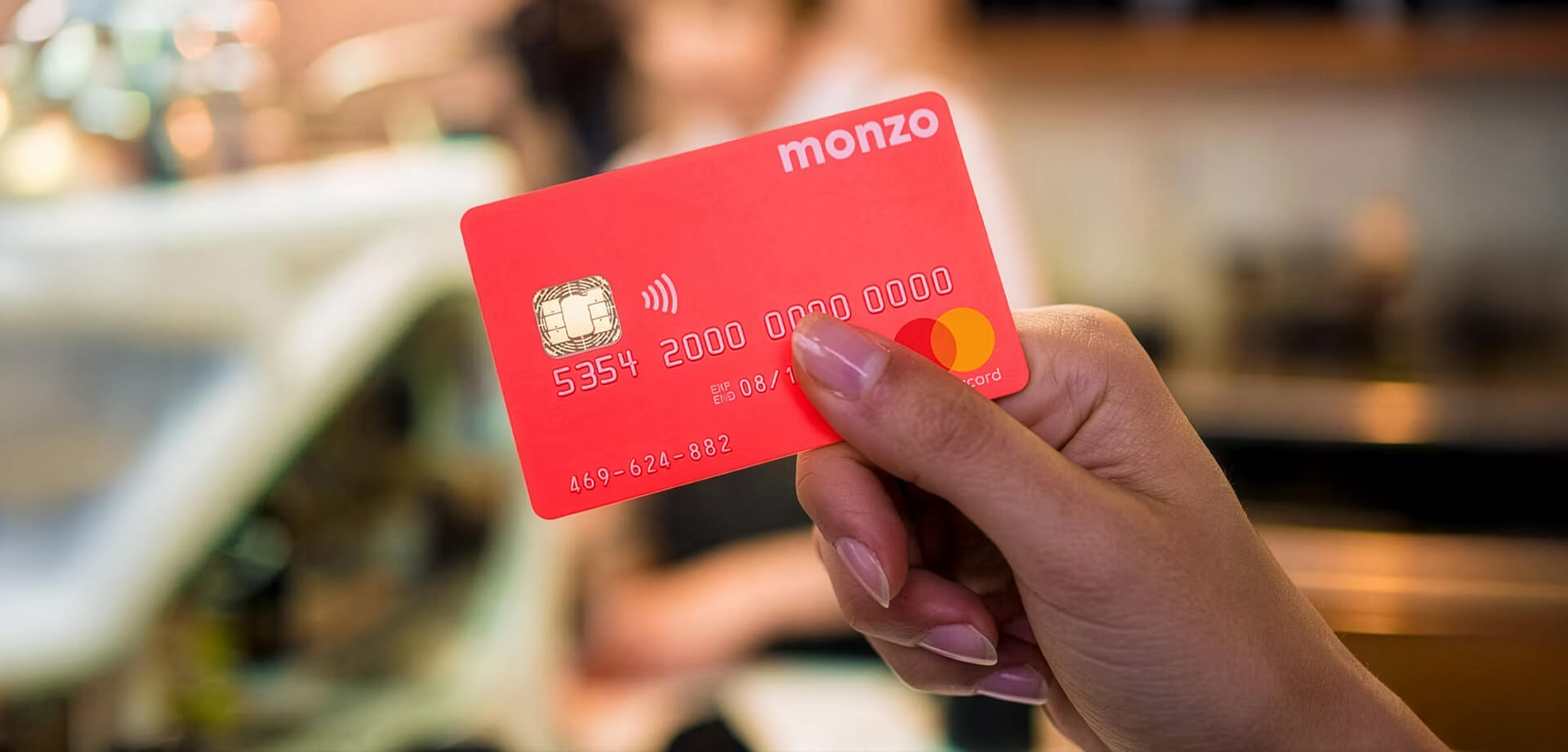 The item shown is a Monzo debit card, a product from the UK-based digital challenger bank, Monzo.
