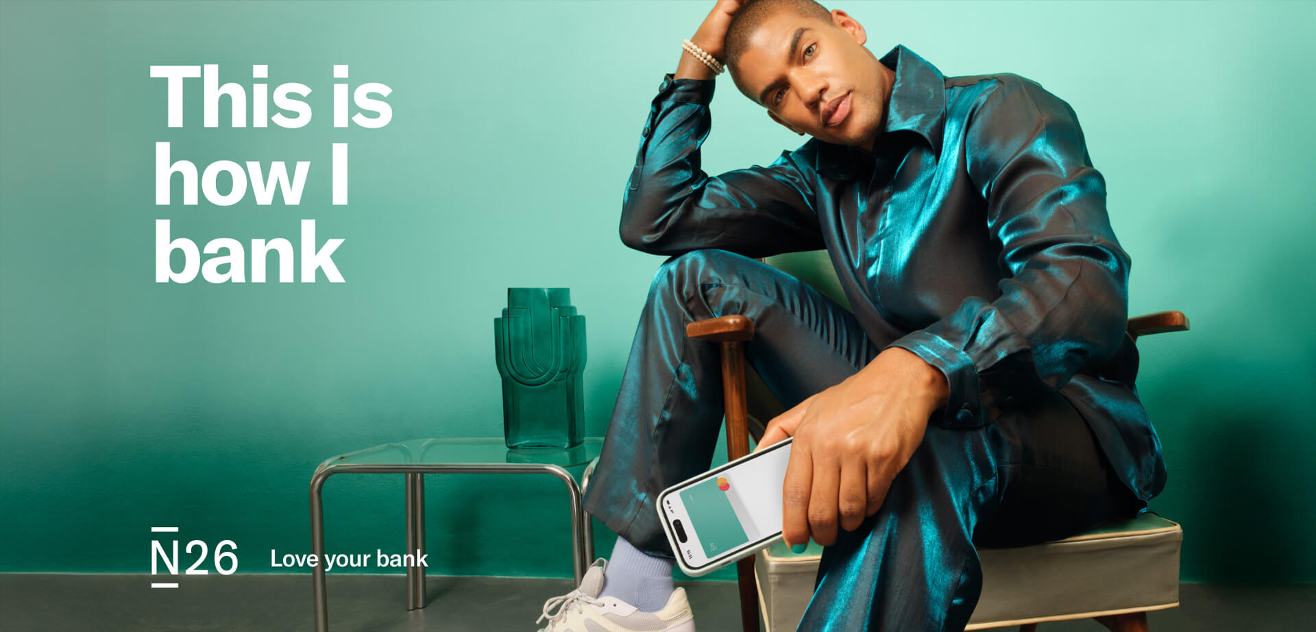 N26 is a European digital bank that offers online banking services and mobile apps for managing finances. The advertisement highlights a modern, personal approach to banking, featuring the tagline "This is how I bank".