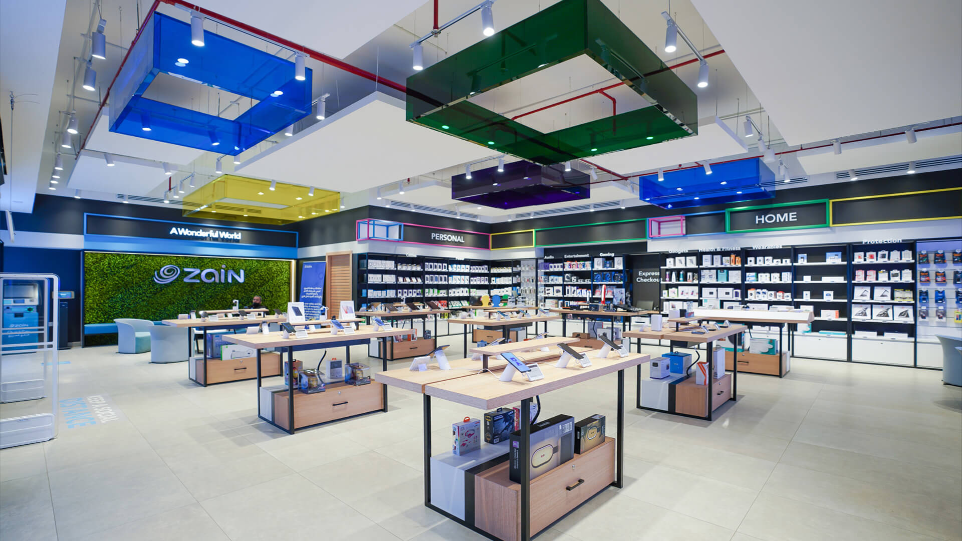A Zain Telecom interior store design featuring a modern, colourful merchandising systems.