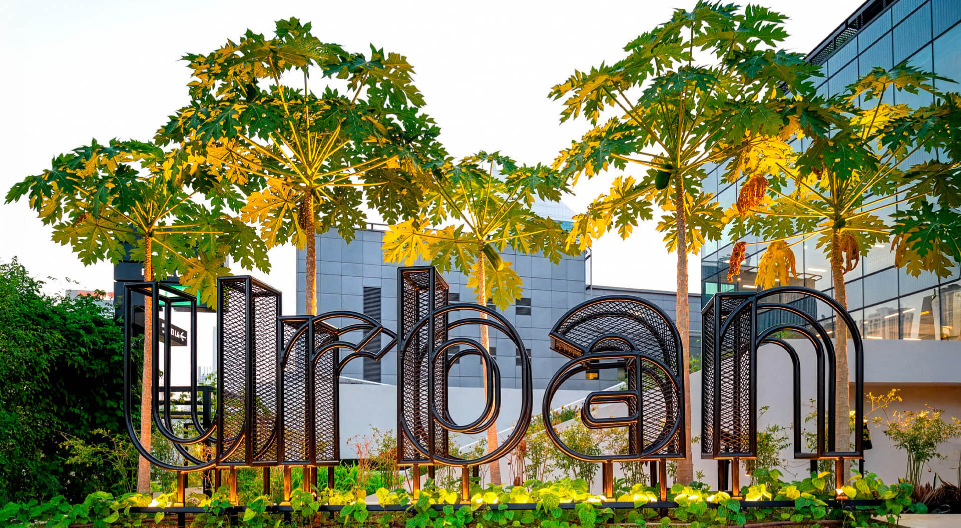 The image shows the "Urban" signage at the rooftop urban farm of the Funan Mall in Singapore.