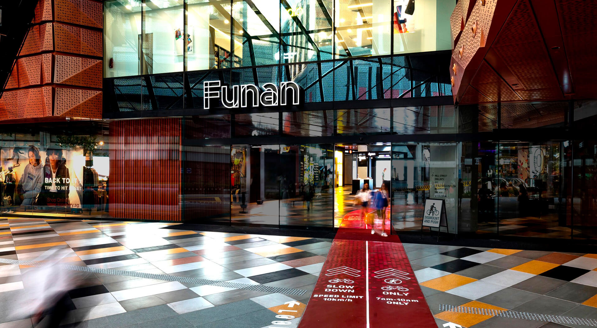 The entrance to Funan, a modern retail and lifestyle mall located in Singapore.  Reopened in 2019 after a major redevelopment, it transformed from a traditional IT hub into a "creative intersection" blending technology, retail, fitness, and lifestyle.