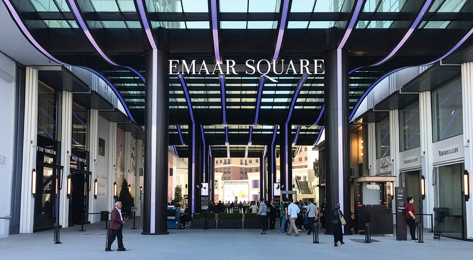 The image shows the prominent illuminated entrance sign and modern architectural facade of Emaar Square Mall located in the Üsküdar district of Istanbul, Turkey.