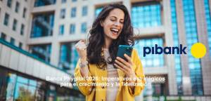 Mujer celebrando la app de Pibank – Banca Phygital 2026: Imperativos Estratégicos para el Crecimient