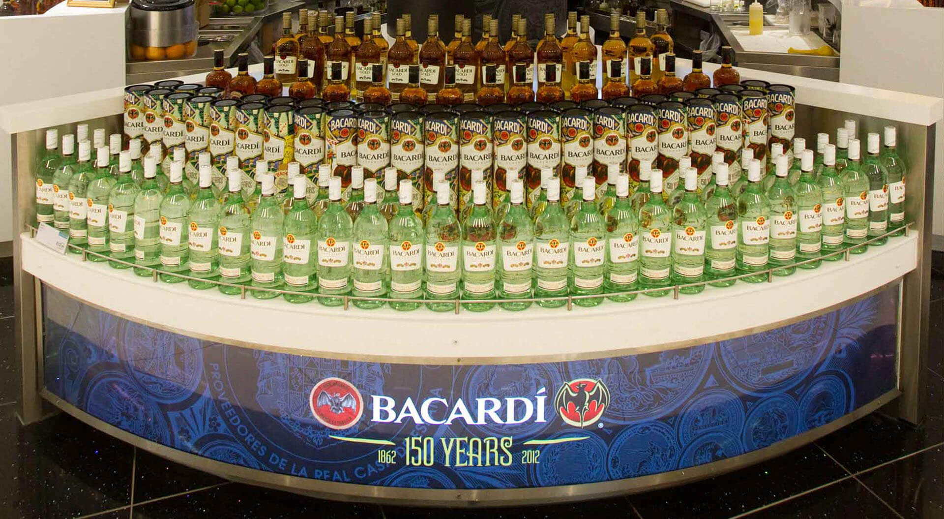 Bacardi 150 Years celebration merchandising system design and store interior World Duty Free Heathrow Terminal 5 graphic promotions Bacardi 150 Years celebration merchandising system design and store interior World Duty Free Heathrow Terminal 5 graphic promotions