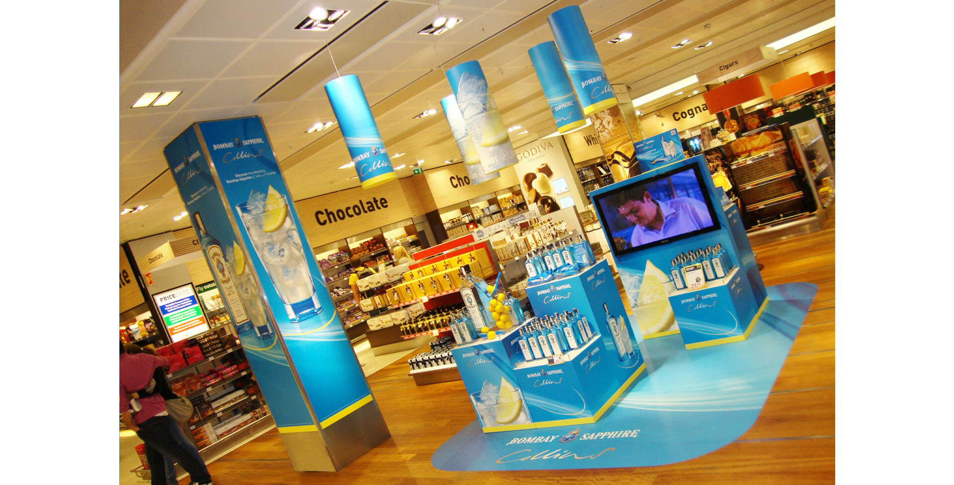 Bombay Sapphire Collins Spirits industry promotion campaigns travel retail design, airports, duty-free airport merchandising and branding Bombay Sapphire Collins Spirits industry promotion campaigns travel retail design, airports, duty-free airport merchandising and branding