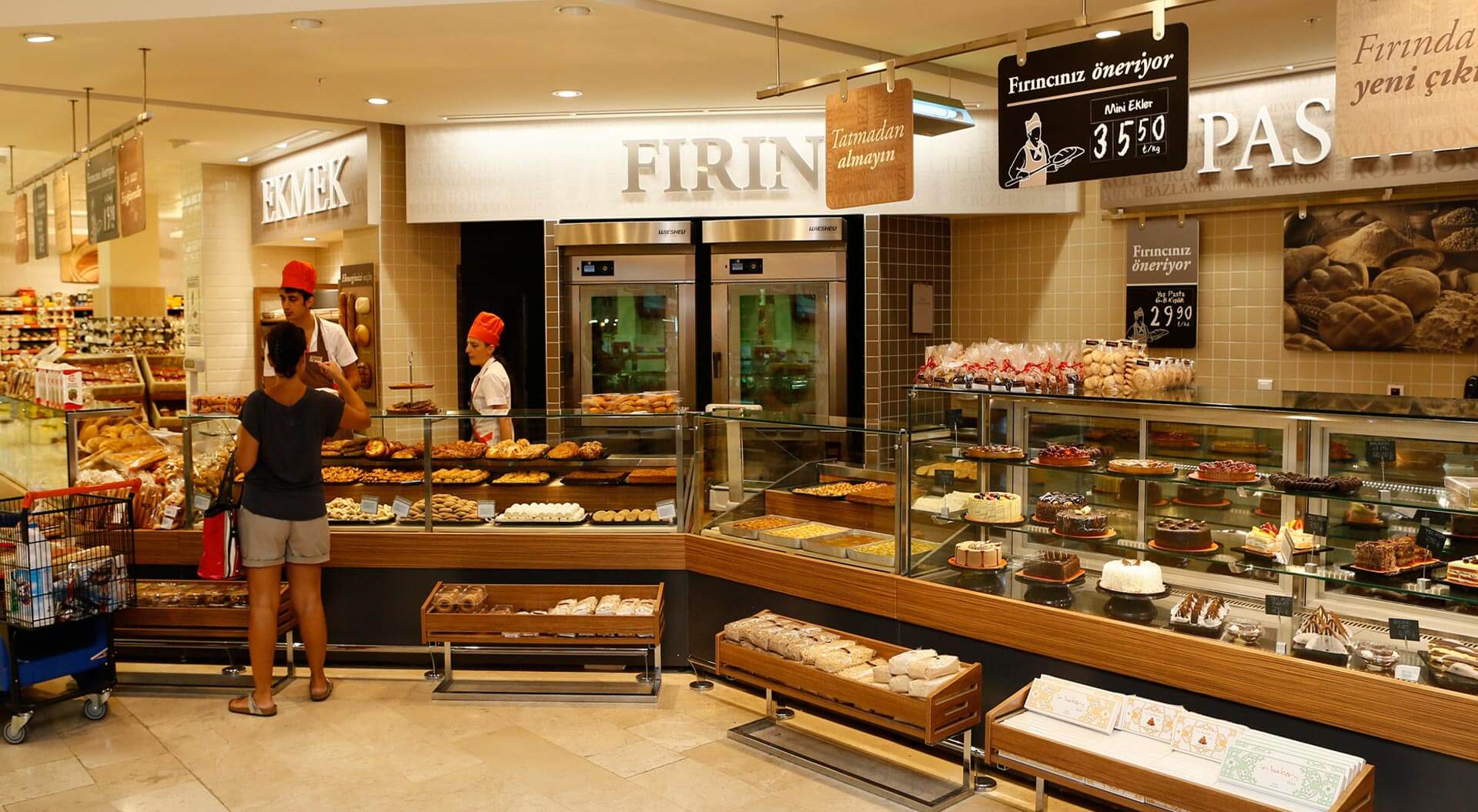 Migros Turkey supermarket bakery merchandising store design and internal brand communications Migros Turkey supermarket bakery merchandising store design and internal brand communications